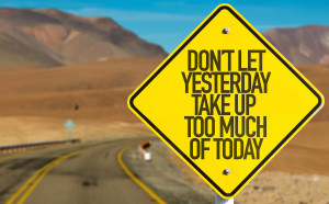 Don't Let Yesterday Take Up Too Much of Today sign on desert road